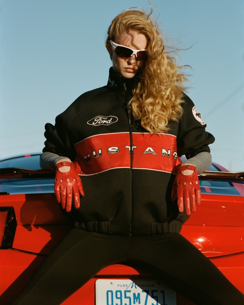 The ultimate fusion of style and speed, accessorized with a Zara's Ford Mustang bomber jacket and bold red racing gloves.