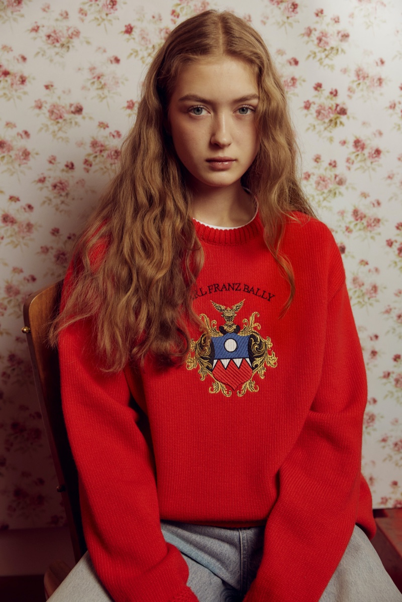 A vibrant red sweater with regal embroidery stands out from Bally's winter 2023 Mountain capsule collection.