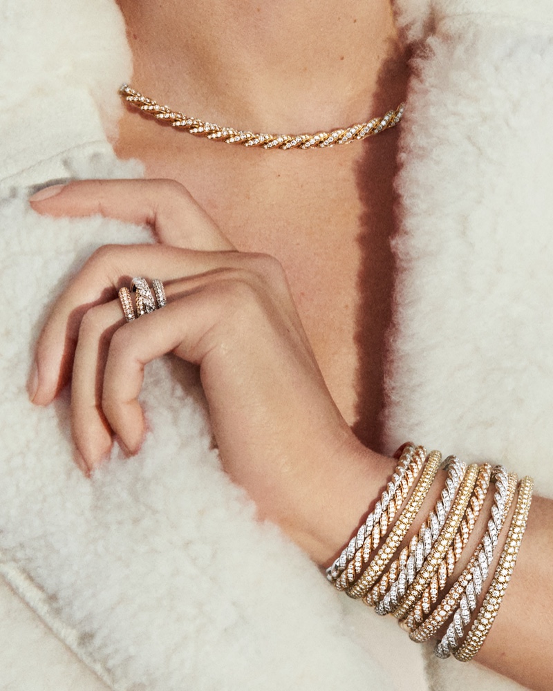 Elegance in layers: David Yurman showcases the luxurious Pavéflex bracelets and rings, complemented by a choker necklace style.