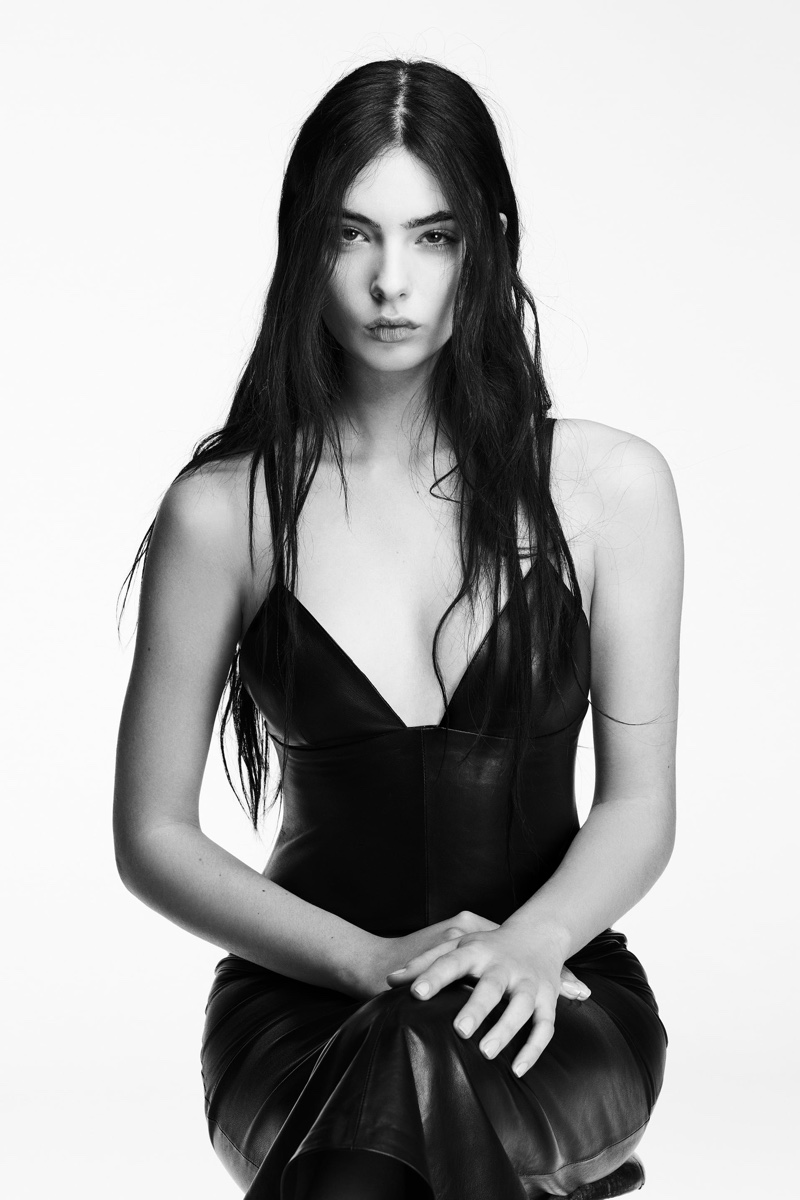 Deva Cassel models a sculpted leather dress from Zara, with spaghetti straps and a v-neckline.