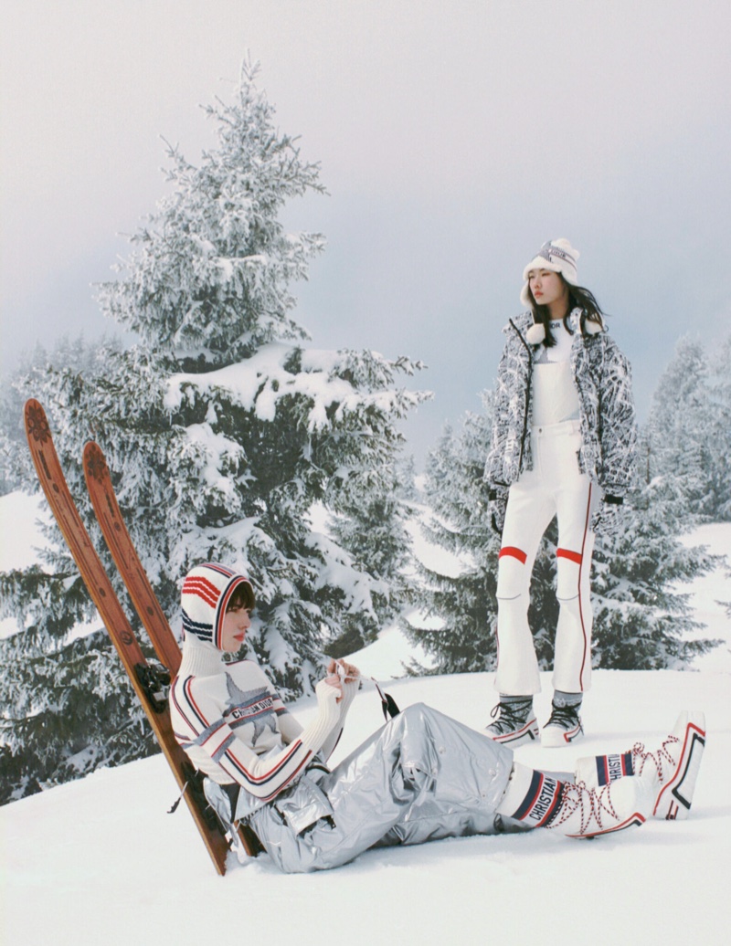 Winter luxury at its finest, Sijia Kang and Carla Rey relax against a snowy backdrop, attired in the DiorAlps 2023 collection.