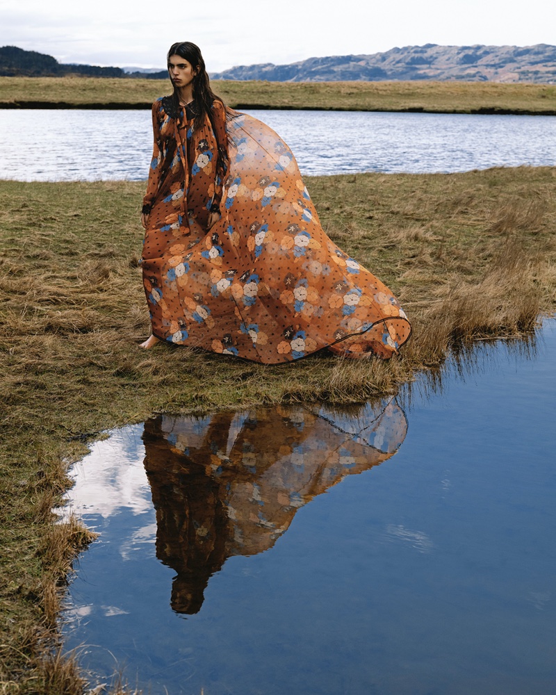 Reflecting nature's tranquility, a flowing Etro dress appears against the picturesque landscape of Scotland for the winter 2023 season.