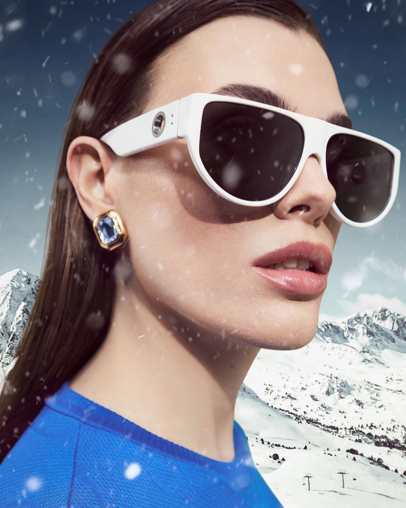 Charli Howard captivates in the winter sun, sporting statement Linda Farrow Elodie flat top sunglasses in winter white.