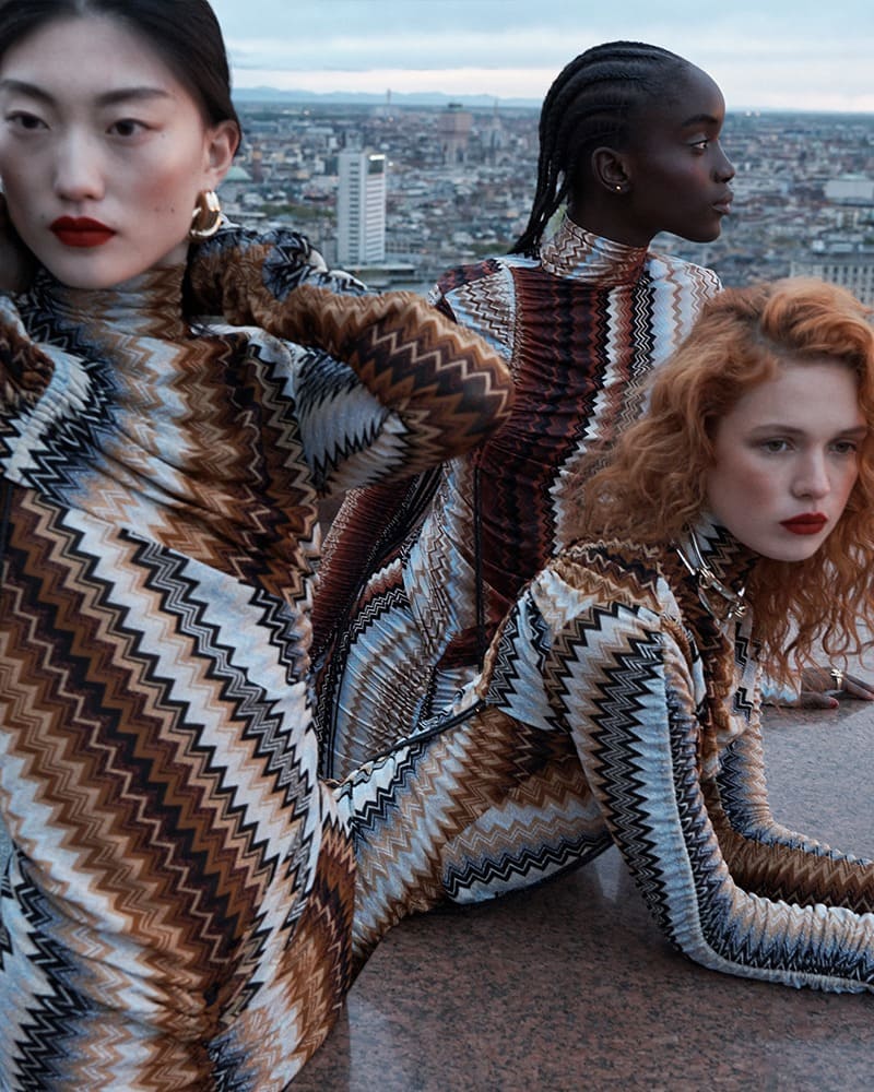 Missoni's winter 2023 patterns pose against a city skyline with striking silhouettes telling a story of bold elegance.
