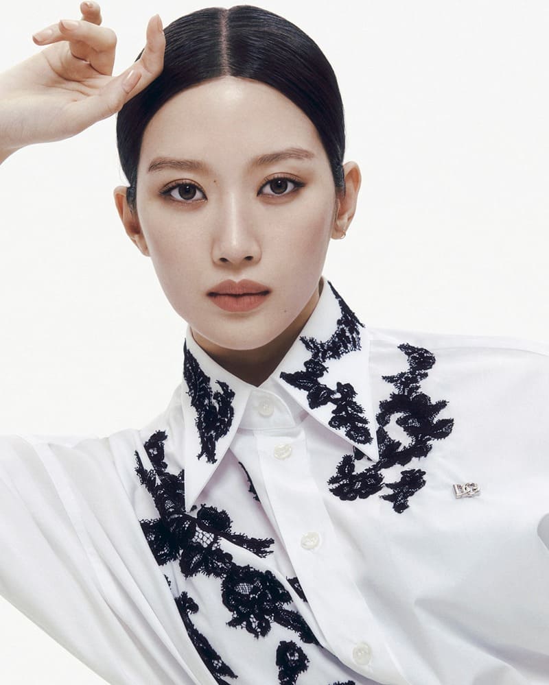Captivating in simplicity, Moon Ga-young represents Dolce & Gabbana in a refined white shirt with intricate black lace detailing.