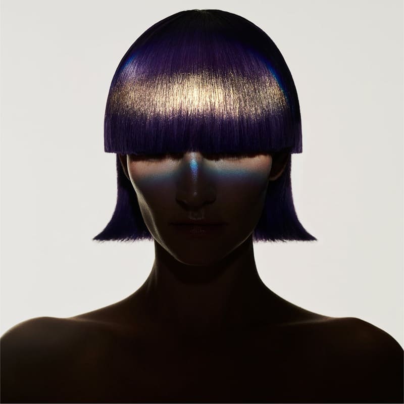 Zara features a portrait of a model wearing a gold bob haircut, featuring iridescent highlights with its Glitter in Gold hair kit.