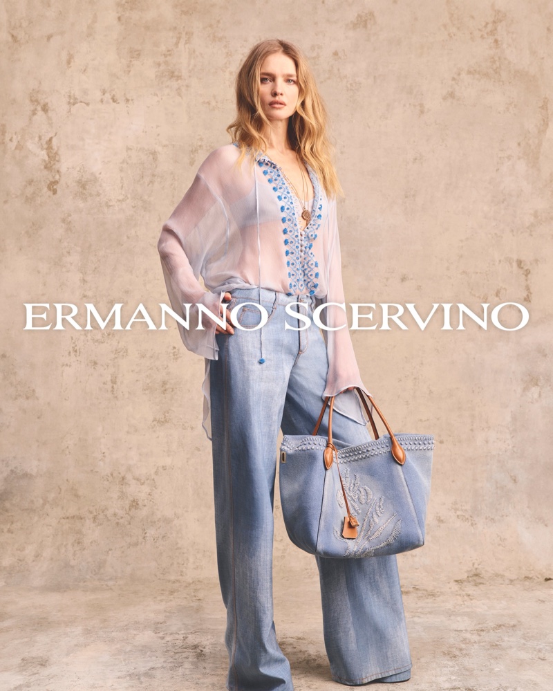 Natalia Vodianova carries an embellished denim bag for Ermanno Scervino's spring-summer 2024 campaign.