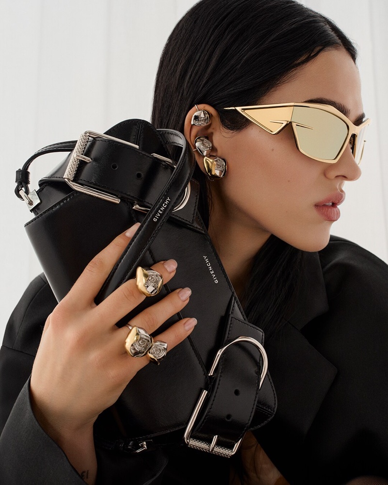 Amelia Gray fronts the Givenchy spring-summer 2024 campaign with gold-toned Giv Cut sunglasses and statement rings.