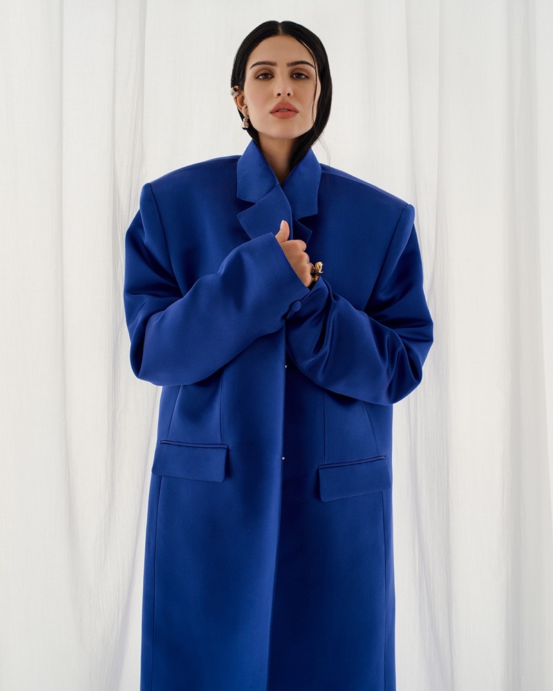 Amelia Gray commands attention in a cobalt blue overcoat for the Givenchy spring-summer 2024 campaign.