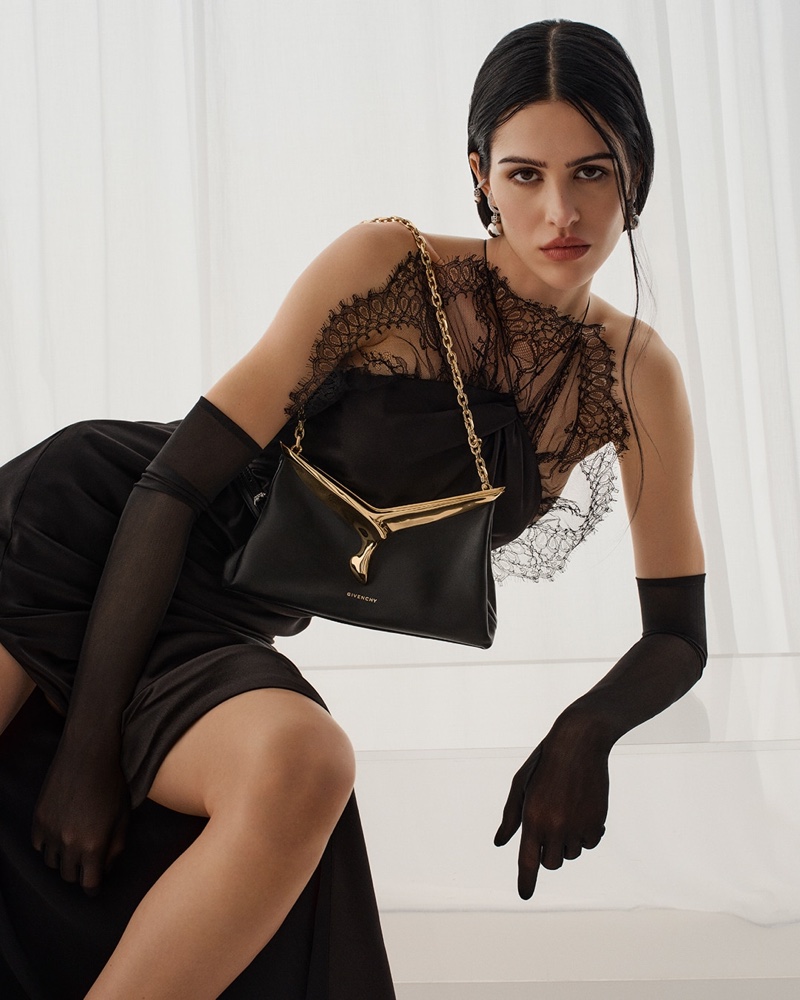 Elegance meets edge as Amelia Gray showcases a black lace gown for the Givenchy spring 2024 ad.