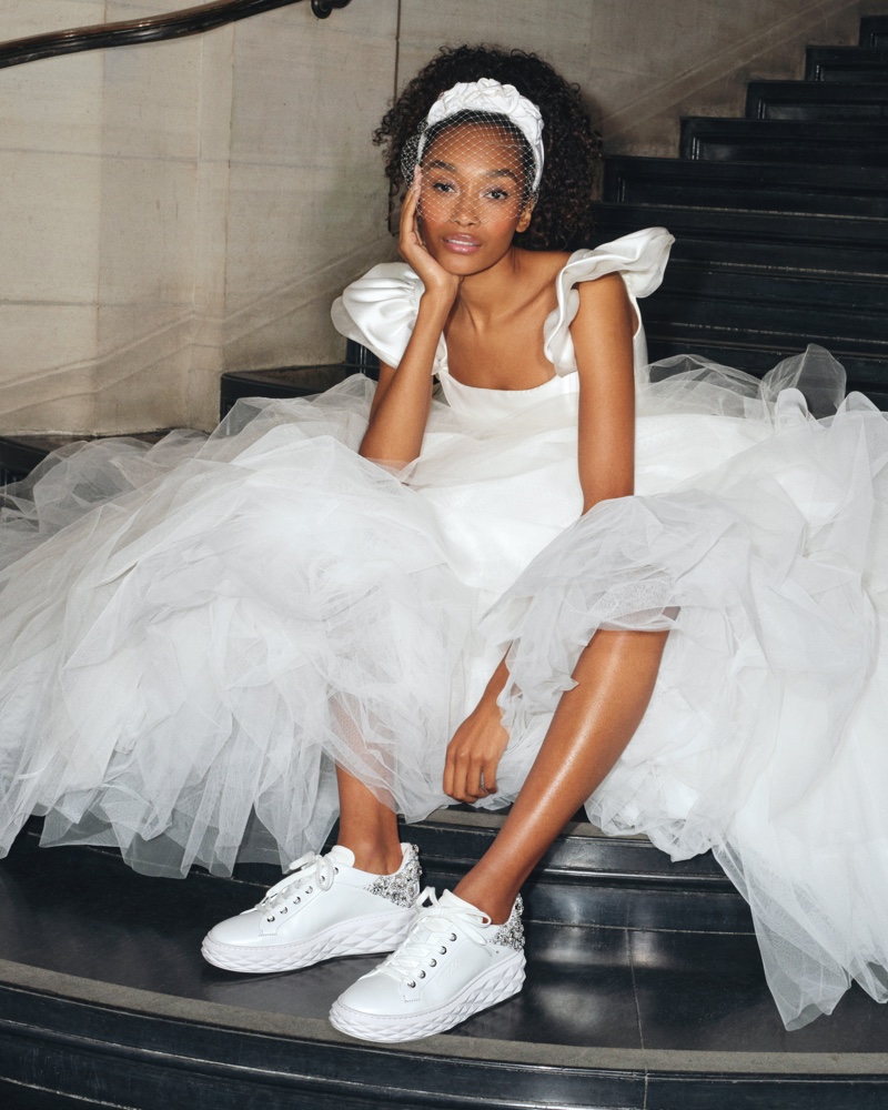 A modern twist on bridal wear, Jimmy Choo pairs sneakers with wedding gowns for 2024.