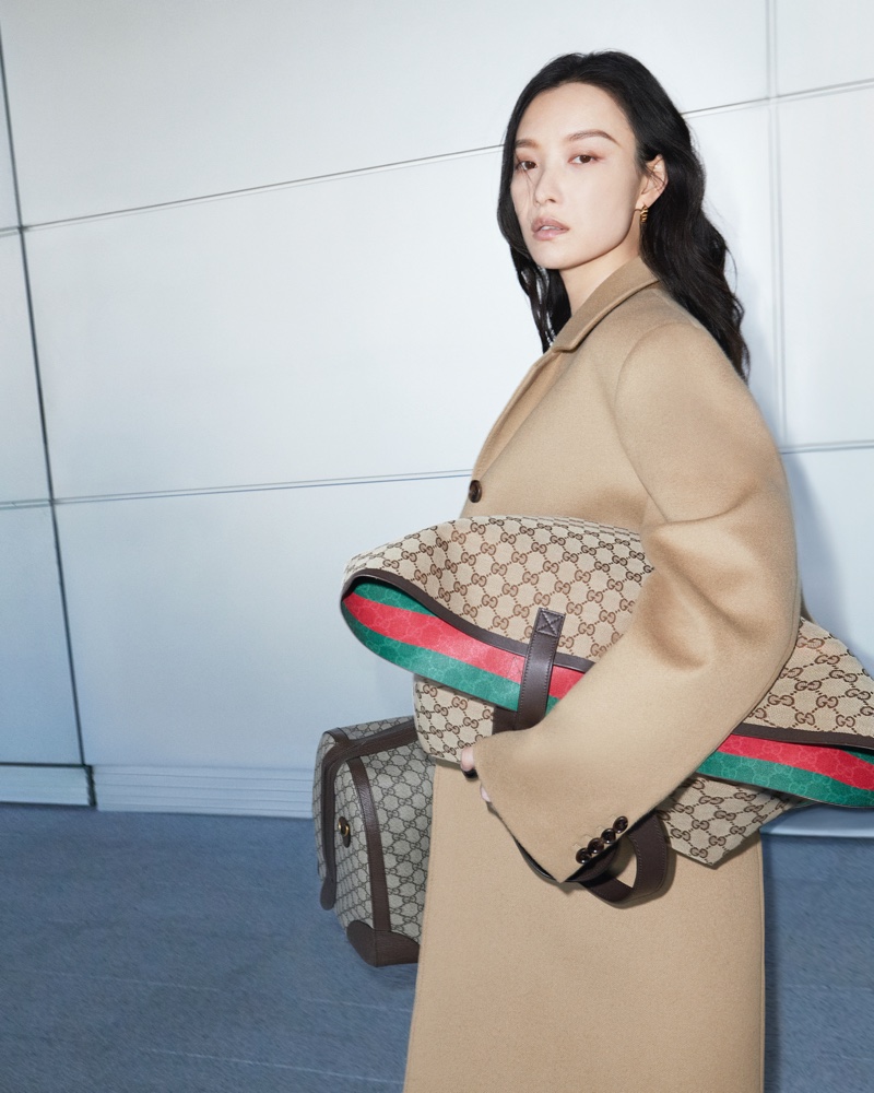 Gucci Valigeria's 2024 campaign showcases Ni Ni, making a statement with iconic luggage pieces.