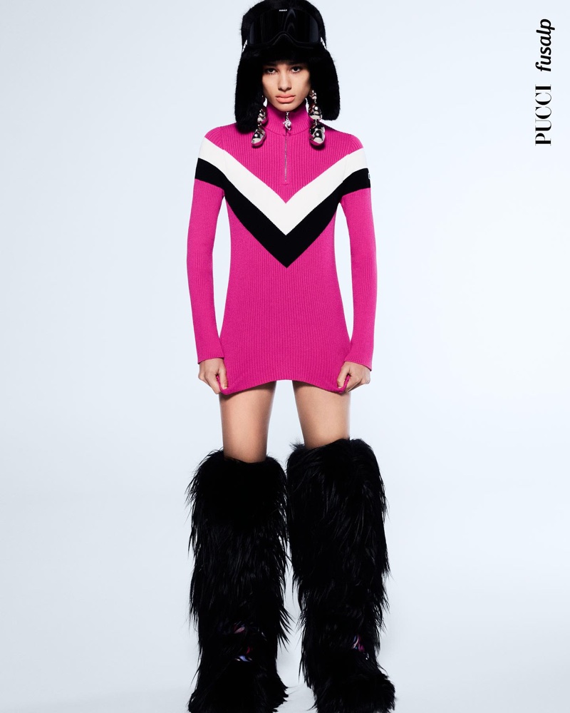 A vision in pink, Annemary Aderibigbe wears a Pucci x Fusalp knit dress with sharp contrasts, ready for après-ski glamour.