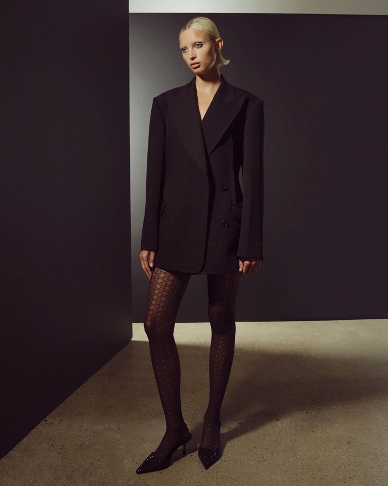 Styled with a blazer, Wolford and Simkhai collaborate on knit tights.