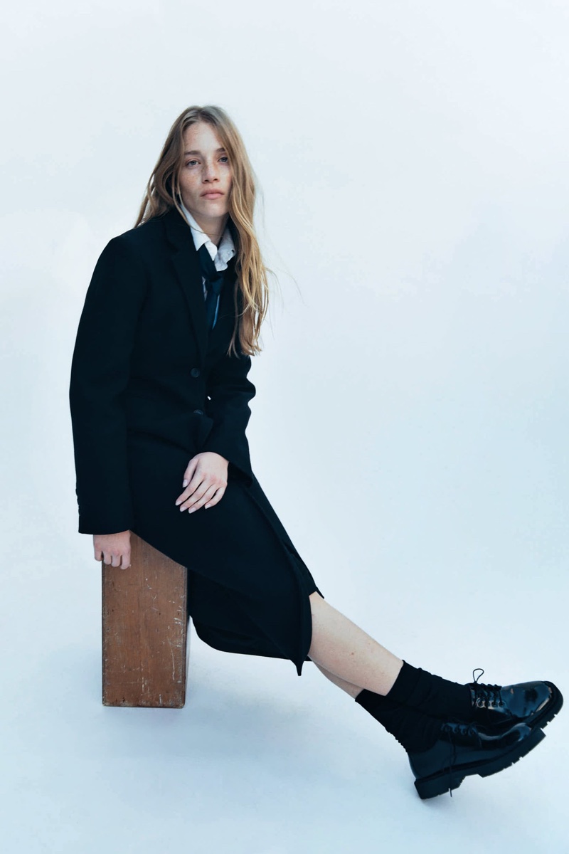 Zara's winter essentials: Rebecca Leigh Longendyke in a chic, tailored coat with lace-up boots.