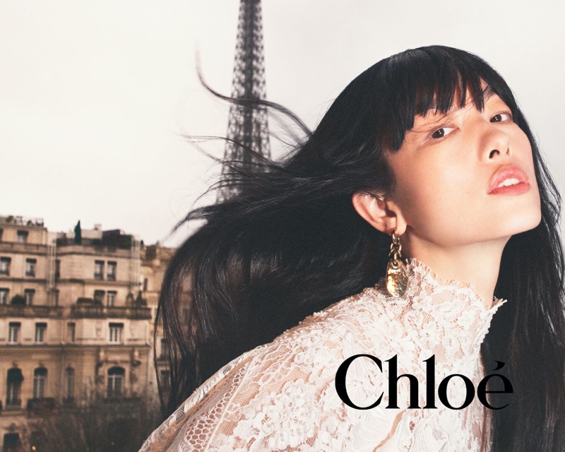 Chloé Portraits 2024 ad captures a windswept moment with Fei Fei Sun wearing white lace.