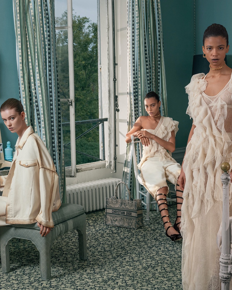 A serene setting frames models draped in ethereal off-white Dior ensembles, highlighting spring-summer 2024's elegance.
