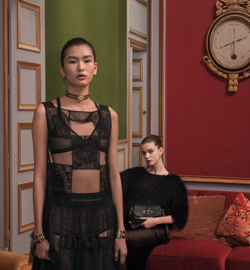 The Dior spring 2024 campaign captivates with models Ying Ouyang and Alice McGrath in intricate black lace and plush textures against opulent decor.