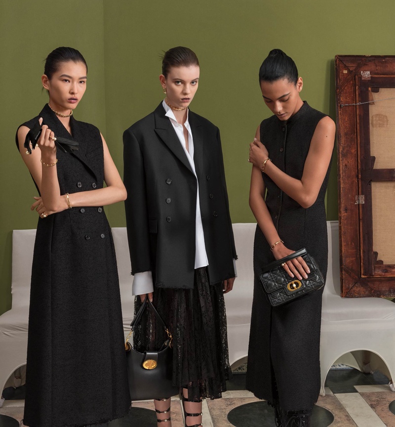 Models pose in structured black designs, showing chic sophistication in the Dior spring-summer 2024 campaign.