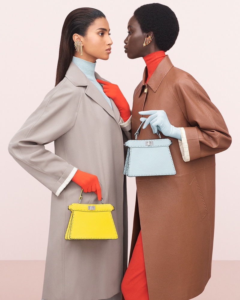 Classic neutrals and vibrant hues stand out in the Fendi spring 2024 campaign with Imaan Hammam and Anok Yai.