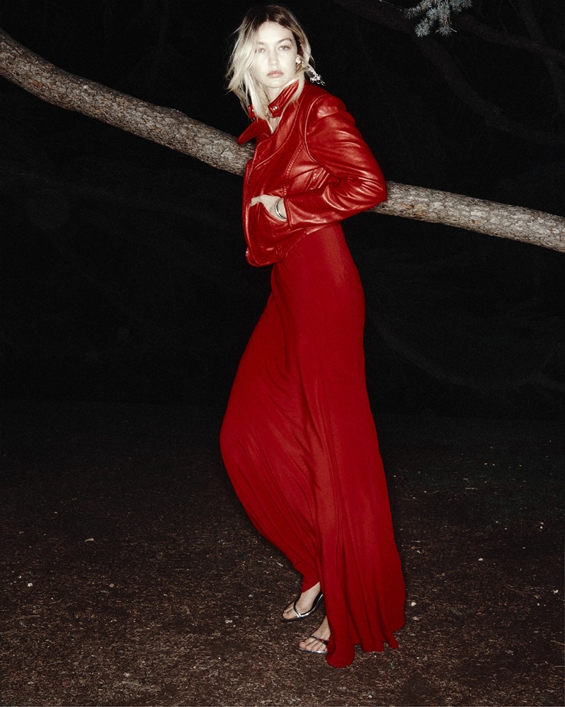 Striking in scarlet, Gigi Hadid models a flowing gown and leather jacket for Isabel Marant's spring 2024 ad.
