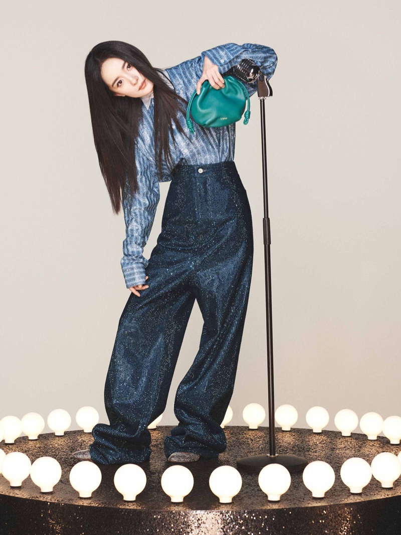 Yang Mi showcases a sparkling blue ensemble with a contrasting green bag for the spring 2024 campaign from Loewe.