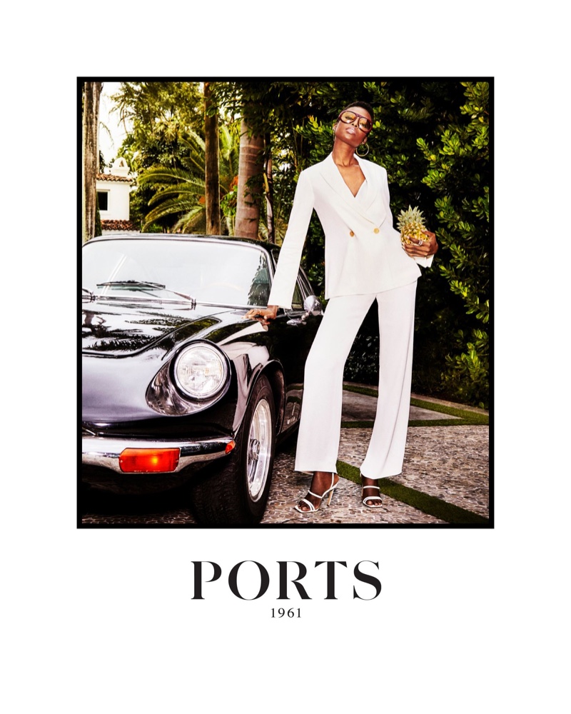 Maria Borges poses in Miami wearing a white pantsuit for Ports 1961's spring-summer 2024 collection.