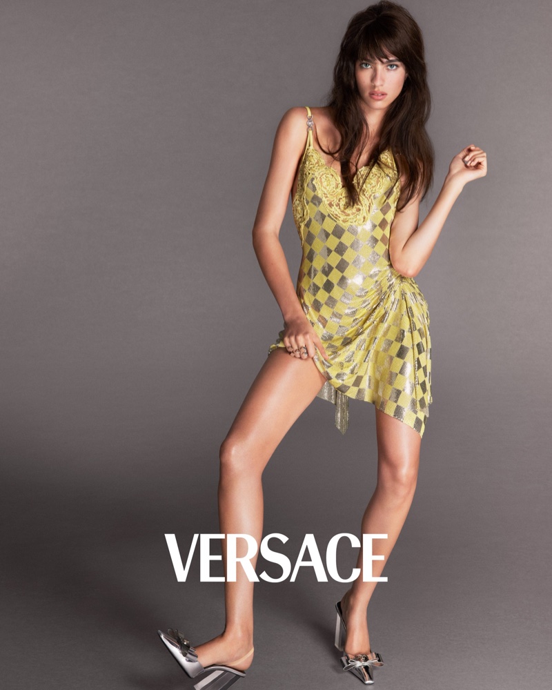 Loli Bahia wears a playful twist on checkerboard chic in Versace's spring-summer 2024 advertisement.