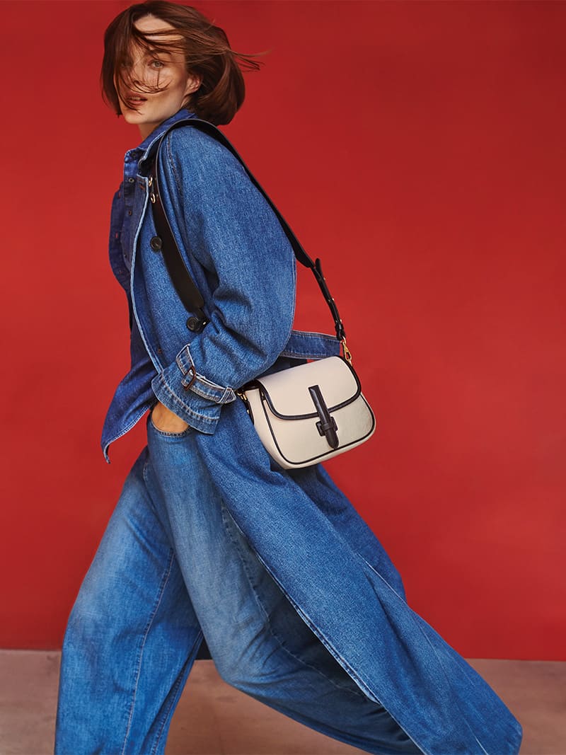 Aylah Peterson dons head-to-toe denim from Weekend Max Mara's spring 2024 collection, accented by a chic crossbody bag.