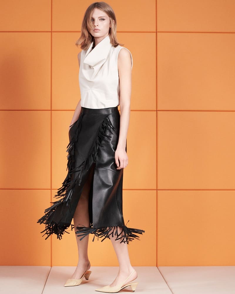Zara spotlights a fringe-detailed leather skirt and a sculptural sleeveless blouse for its spring leather edit.