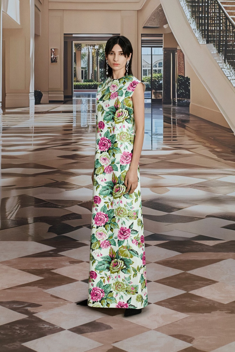 Balenciaga's summer 2024 advertisement captures floral elegance with a long, rose-patterned dress.