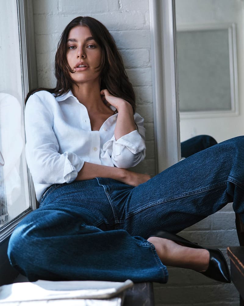 Camila Morrone captures the essence of laid-back elegance in Calvin Klein's classic blue jeans for spring 2024.