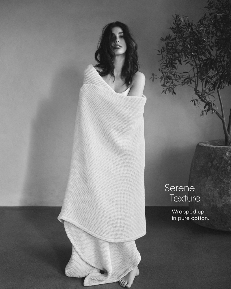 Wrapped in pure cotton, Camila Morrone gets serene in Calvin Klein Home's spring 2024 campaign.