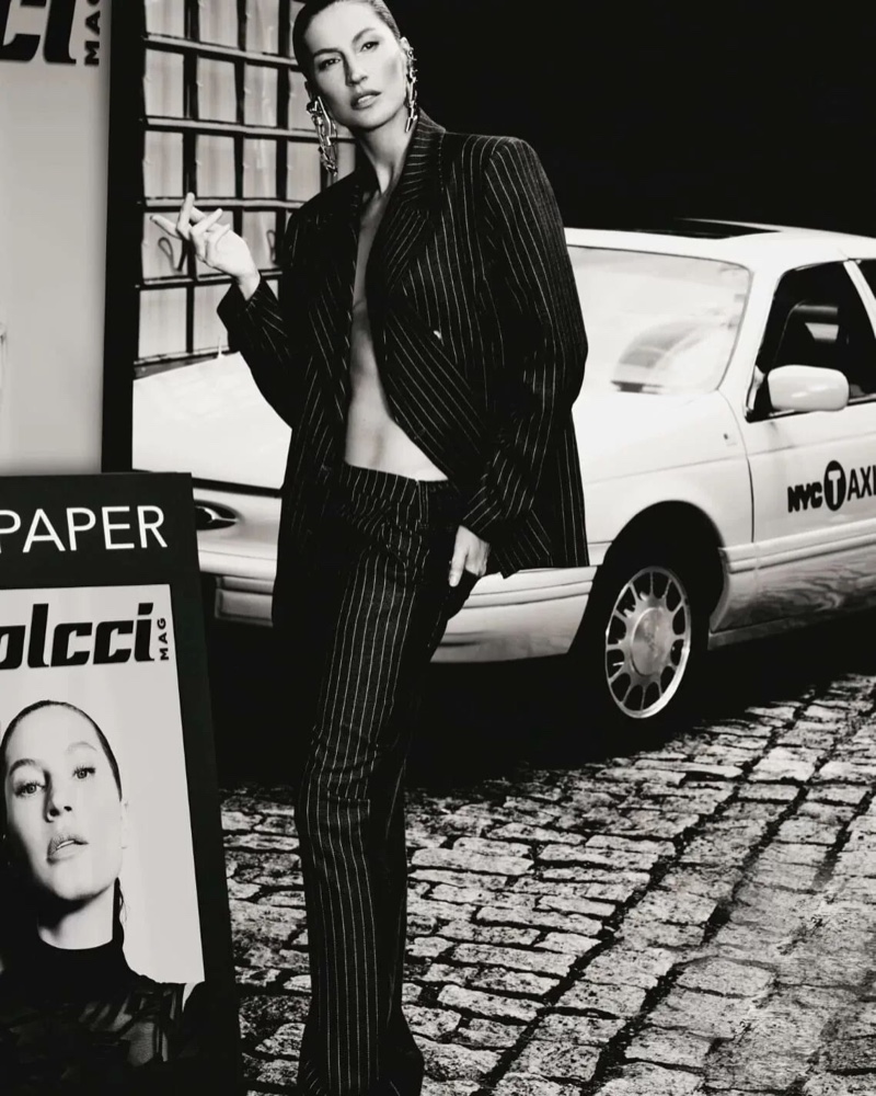 Posing next to a NYC cab, Gisele Bundchen shows off a pinstriped suit for Colcci's fall 2024 ad.