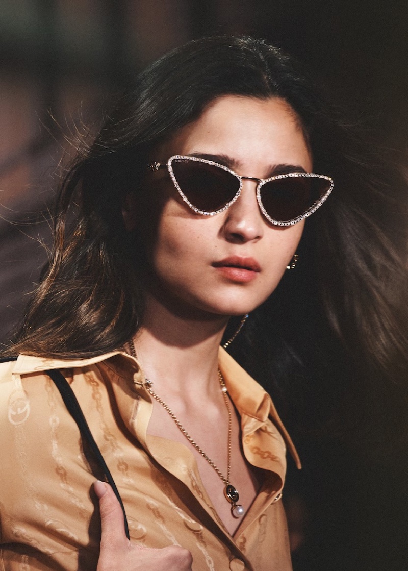 Alia Bhatt shows off cat-eye sunglasses with shimmering embellishments for the Gucci eyewear spring 2024 ad.
