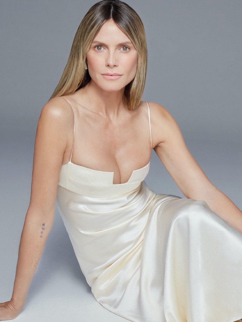 Looking ethereal in white, Heidi Klum wears an elegant slip dress.