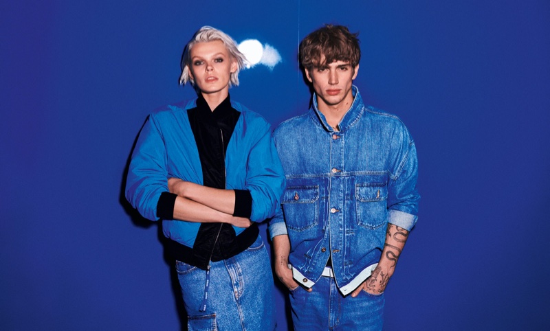 Cara Taylor and Vinnie Hacker in bold blue and denim ensembles for HUGO's spring-summer 2024 advertisement.