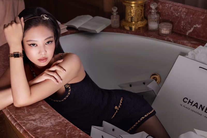 Wearing a black dress with gold detailing, Jennie exudes sophistication with the Chanel Première Édition Originale timepiece.