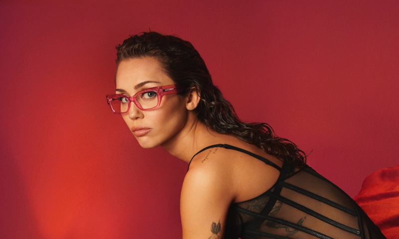 Miley Cyrus showcases pink glasses in Dolce & Gabbana eyewear's spring-summer 2024 campaign.