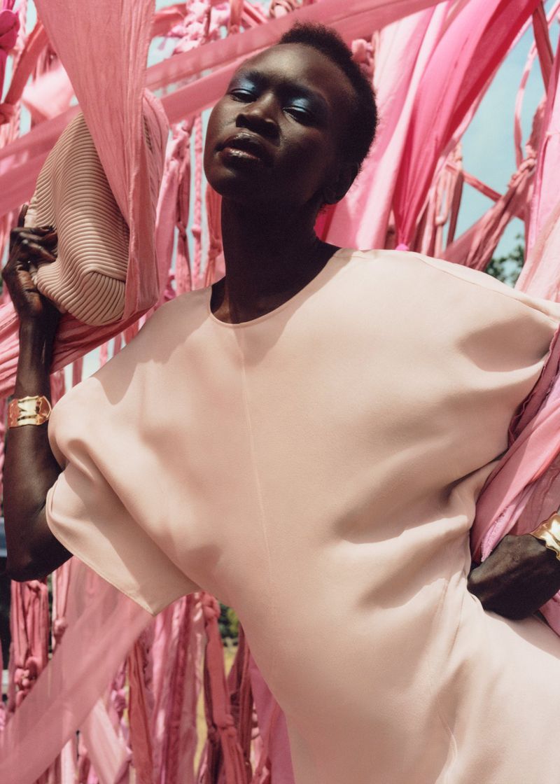 Alek Wek, draped in delicate spring blush, brings a touch of serenity to & Other Stories' spring 2024 campaign.