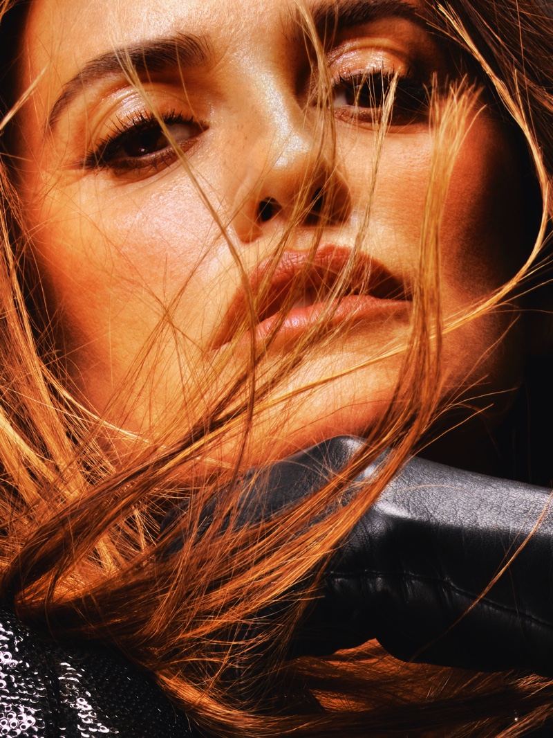 Close-up of Penélope Cruz, highlighting her windswept hair.