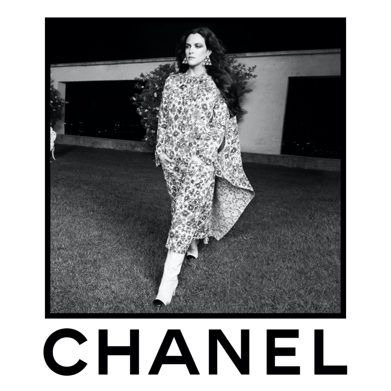 For Chanel's spring 2024 advertisement, Riley Keough enchants in a flowing floral dress with boots.