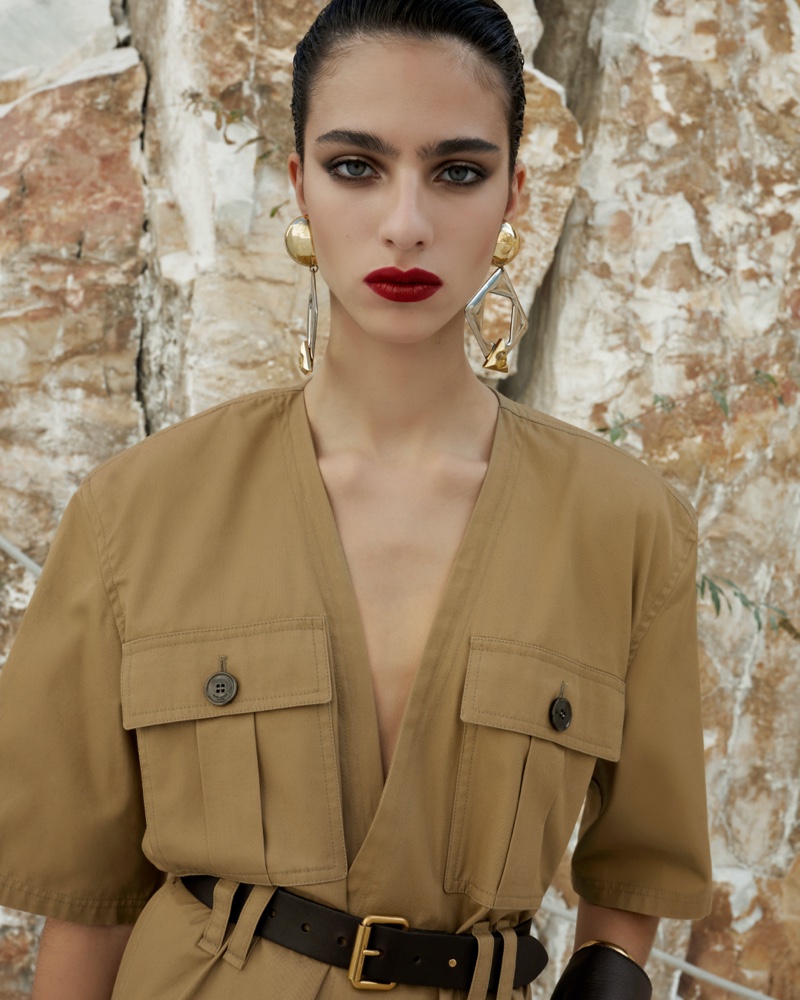 The Saint Laurent summer 2024 campaign highlights khaki apparel paired with striking earrings worn by Loli Bahia.