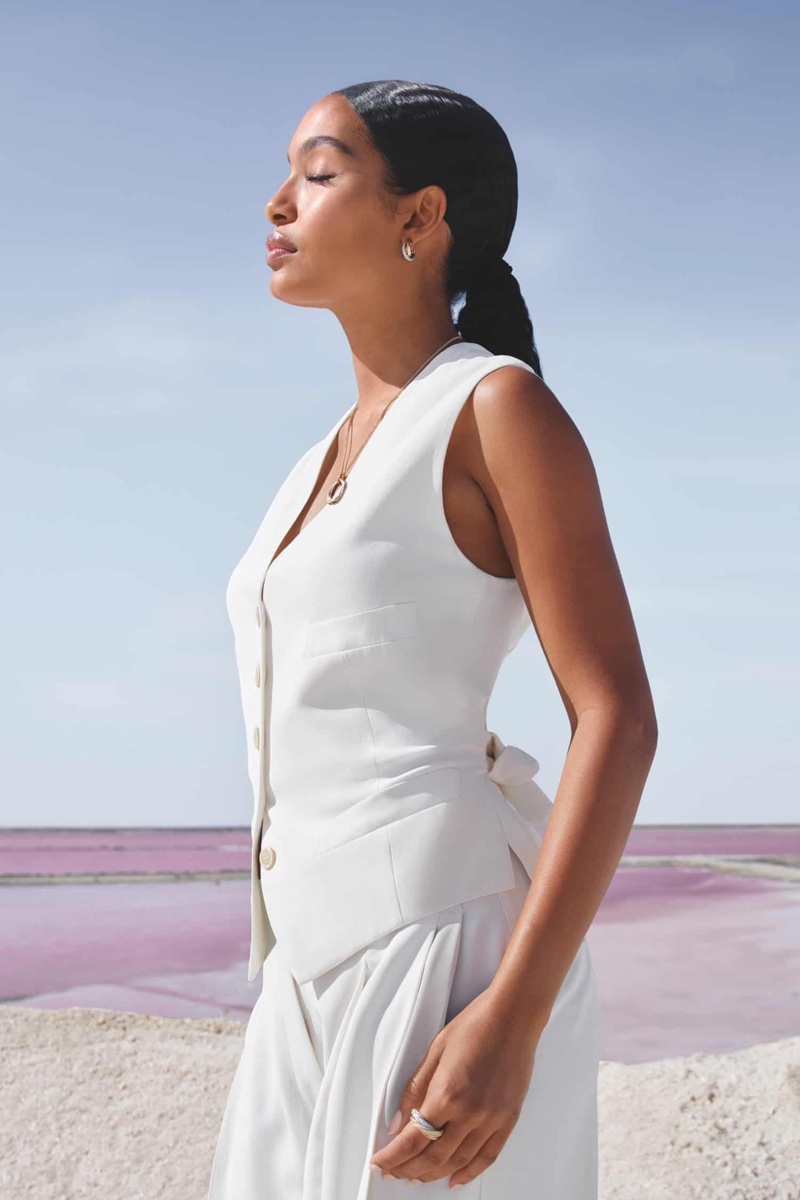 In a minimalist white suit, Yara Shahidi fronts Cartier's Trinity jewelry ad.
