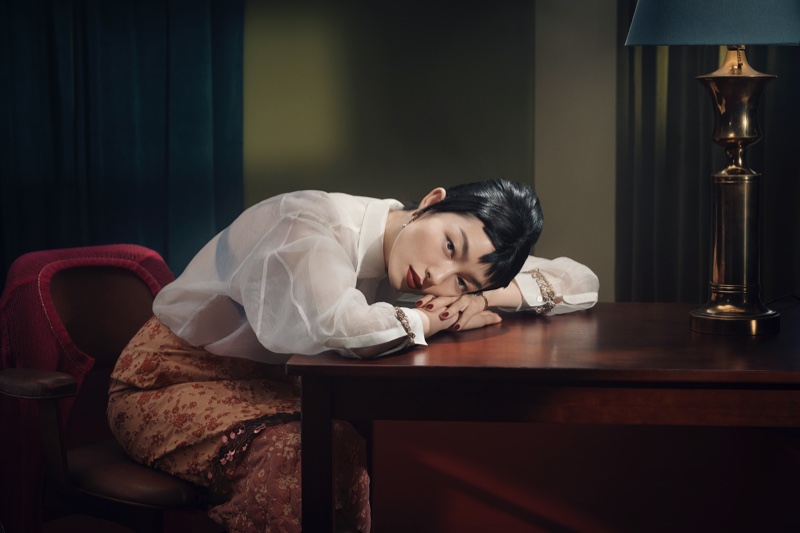 Fei Fei Sun wears a sheer white blouse and patterned skirt in Zara's spring 2024 campaign.