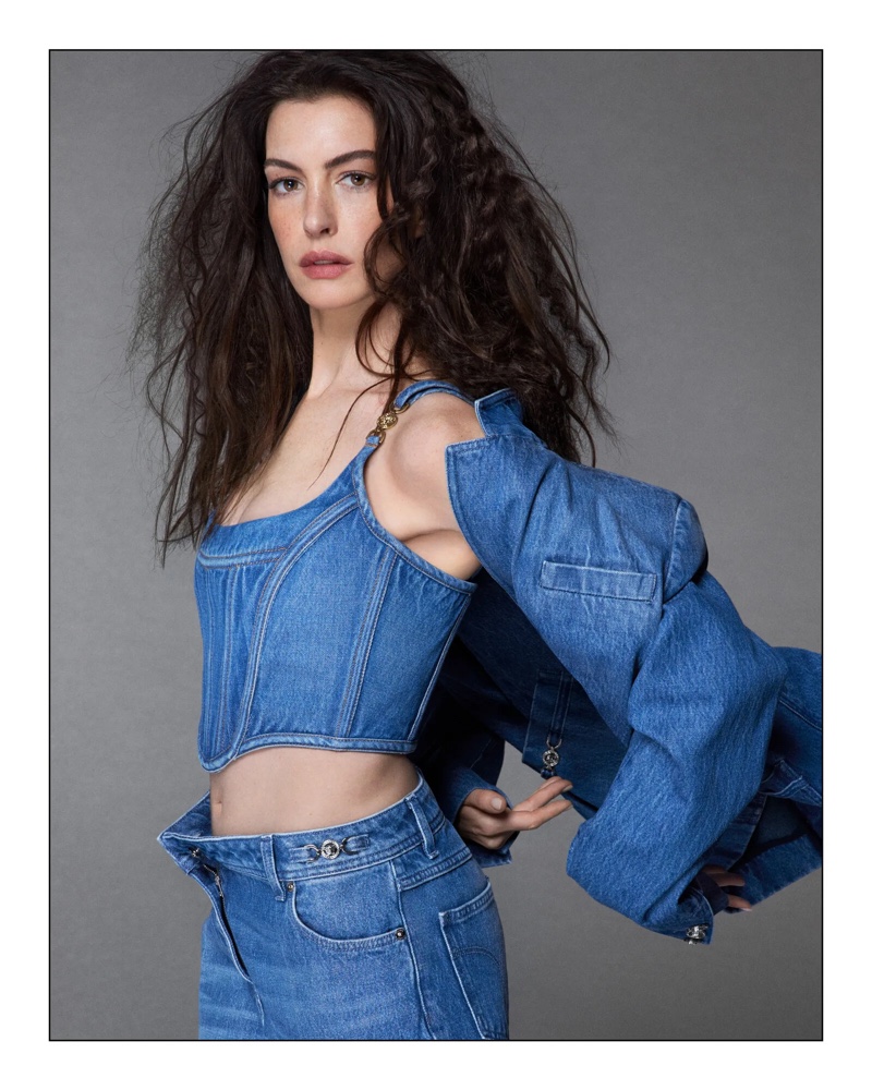 Anne Hathaway debuts a triple denim look for Versace Icons 2024 ad, exuding casual elegance.