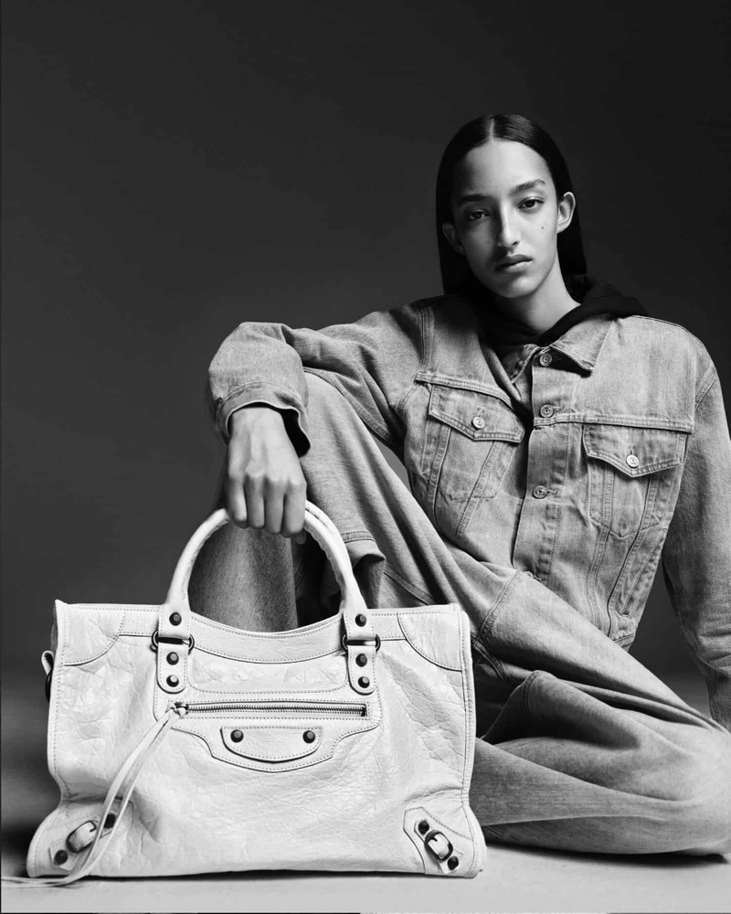 Mona Tougaard rocks denim outfit in Balenciaga Le City bag 2024 campaign.