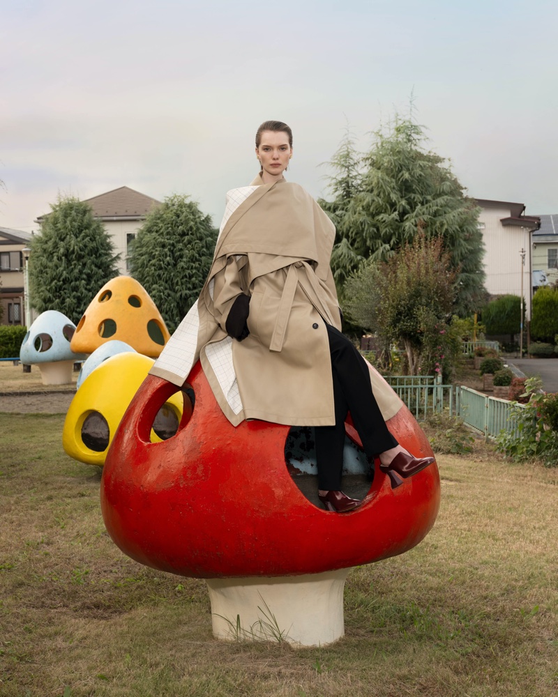 Bottega Veneta showcases a layered trench ensemble for its summer 2024 ad starring Penelope Ternes.