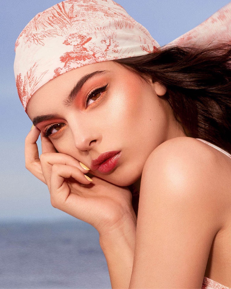Wearing a coral look, Deva Cassel fronts Dior Makeup summer 2024 campaign.