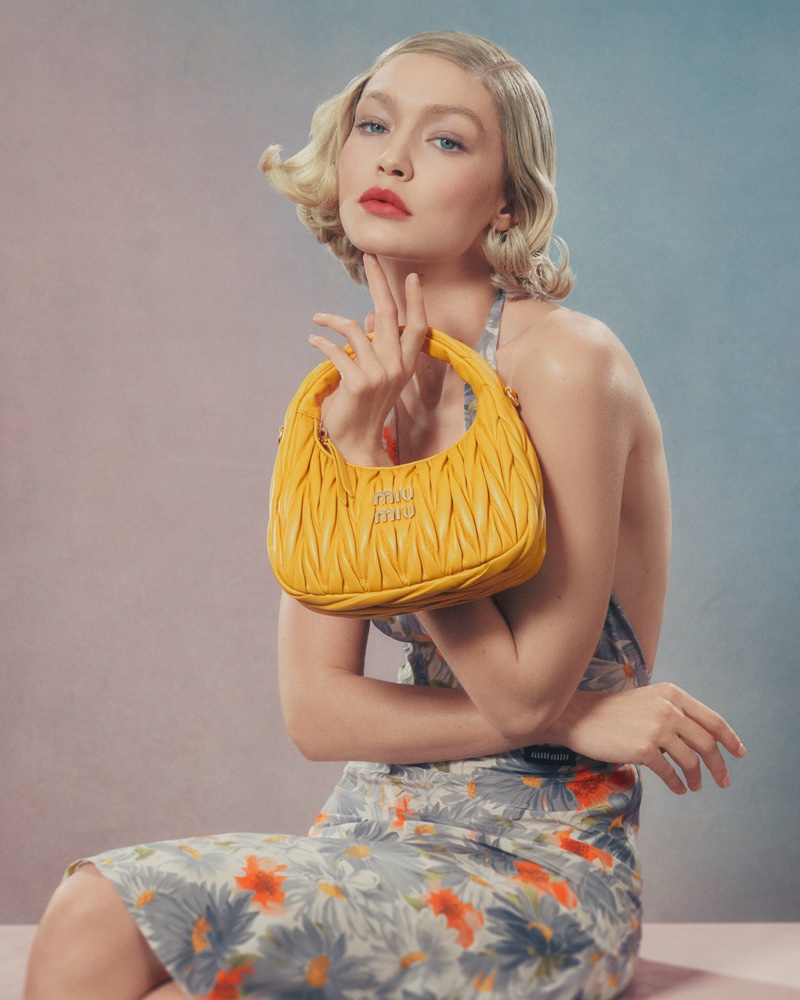 Florals and vibrant yellow unite as Gigi Hadid presents Miu Miu's Wander 2024 handbag design.